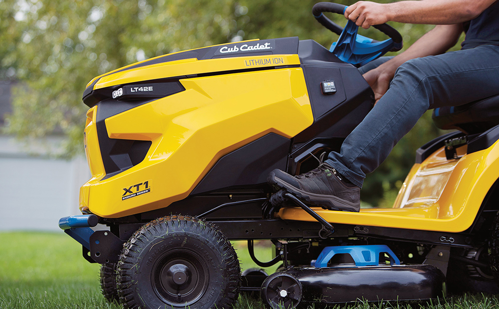A picture of a lawn with a Cub Cadet lawn tractor cutting the grass