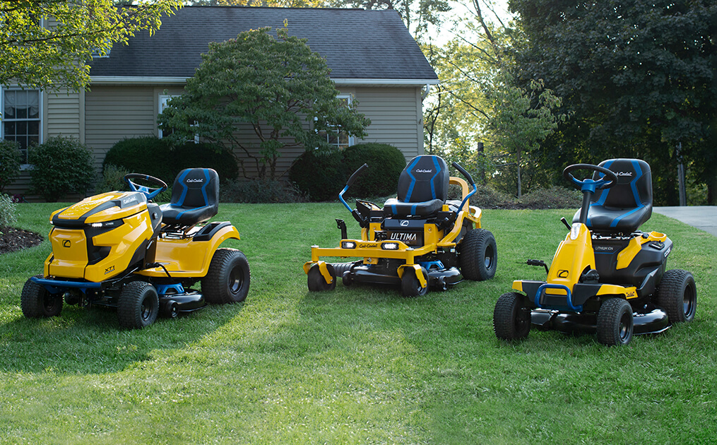 A picture of a Cub Cadet gas-powered mower and an electric-powered mower side by side